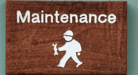 Maintenance sign with avatar holding wrench